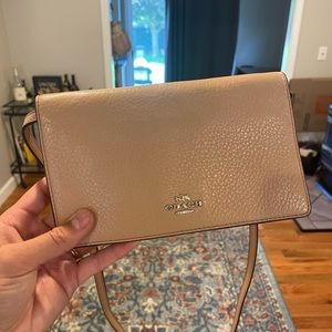 Coach crossbody in a dusty pink color